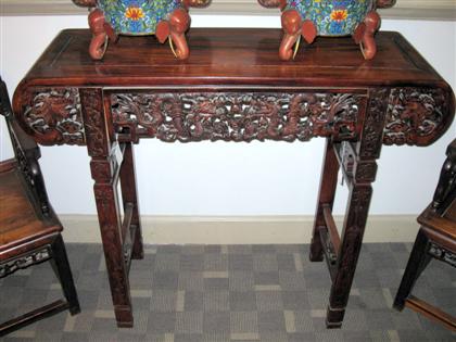 Appraisal: Chinese hardwood altar table Of long rectangular top with rounded