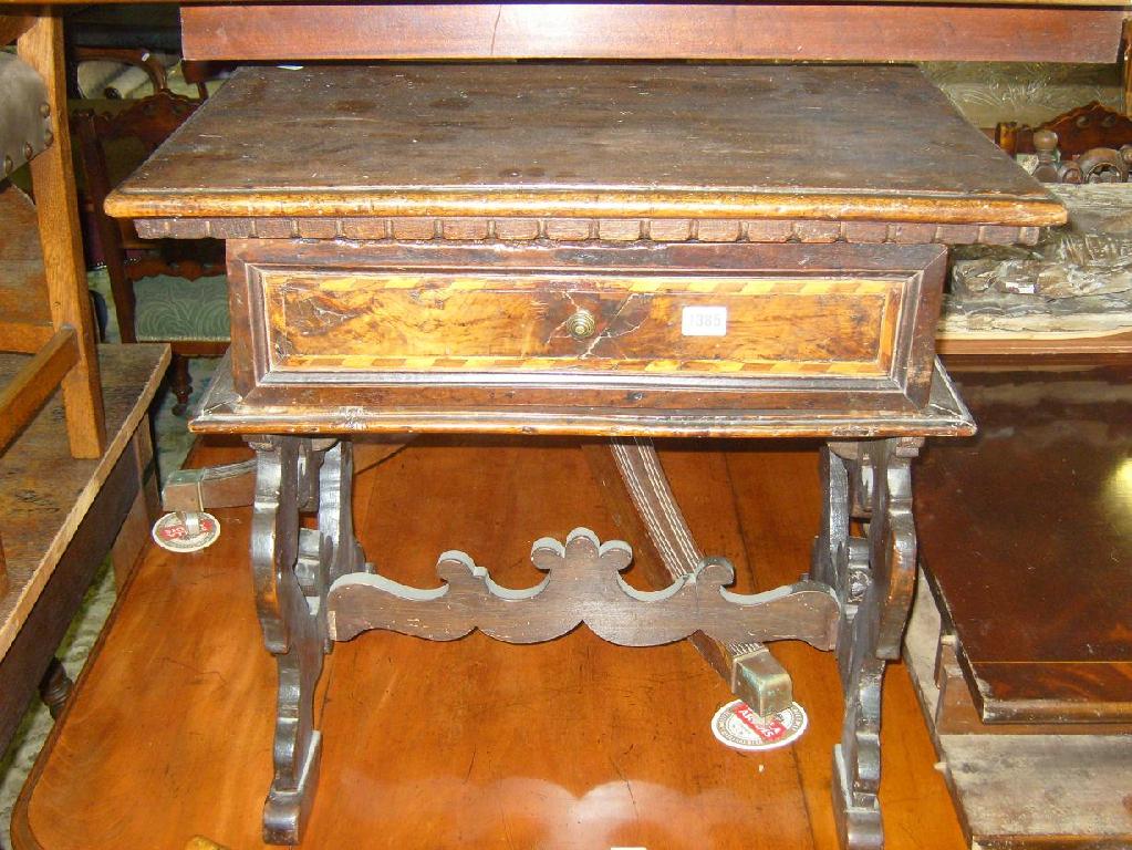 Appraisal: An th century continental walnut side table fitted with a