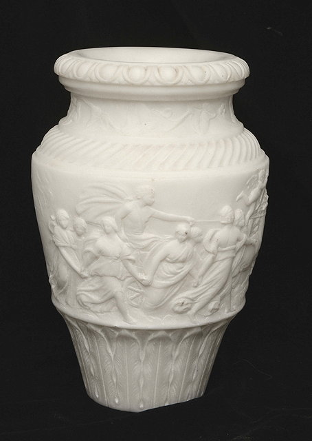 Appraisal: A CARVED CARRARA MARBLE URN decorated in low relief with