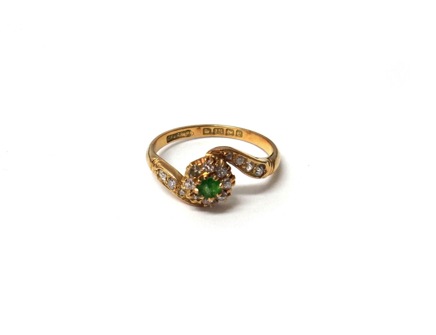 Appraisal: An ct gold demantoid garnet and diamond set cluster ring