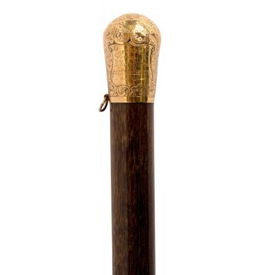 Appraisal: A malacca walking cane with gold engraved top and presentation