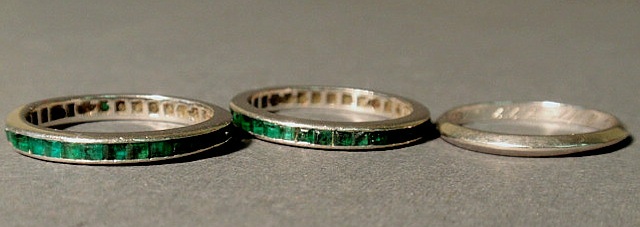 Appraisal: Pair of platinum and emerald guard rings channel set size