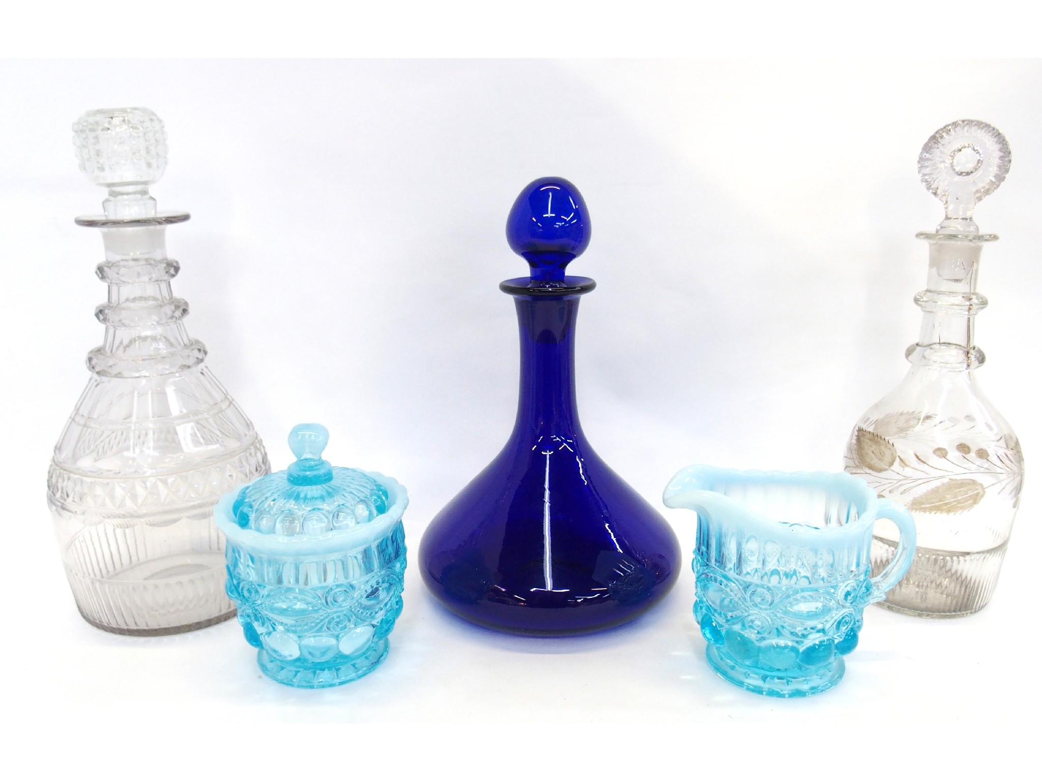 Appraisal: Blue glass decanter two other decanters and a pressed glass