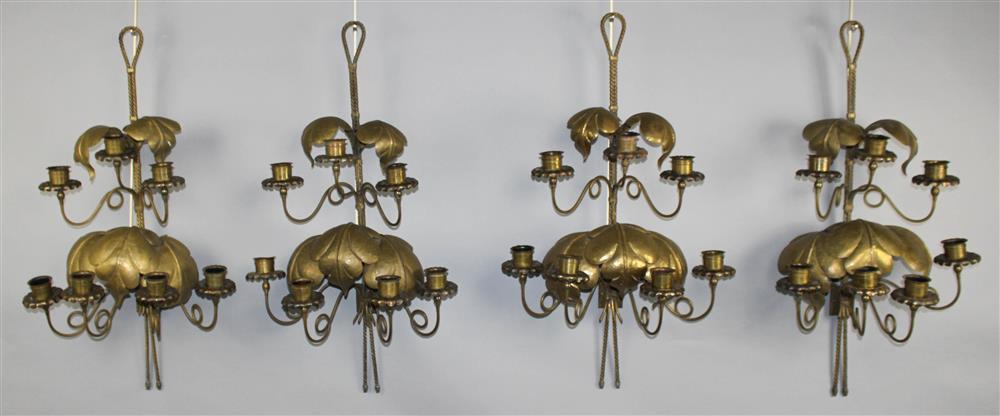 Appraisal: ECLECTIC SET OF FOUR BRASS TWO-TIERED CANDLE SCONCES decorative looped