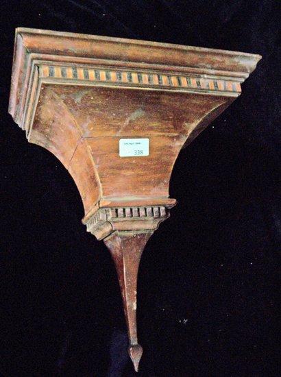 Appraisal: A mahogany wall bracket with chequered inlay and dentil banding