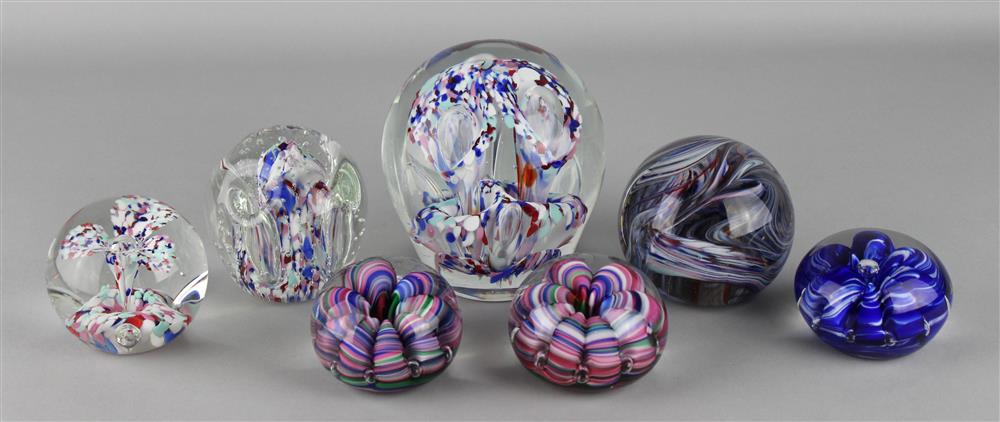 Appraisal: SEVEN SANDWICH GLASS ITEMS including a door stop with three