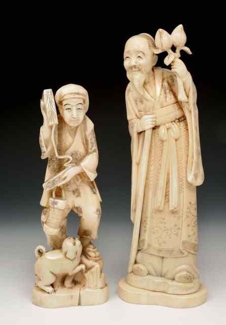 Appraisal: A JAPANESE WALRUS IVORY OKIMONO standing Immortal holding staff and