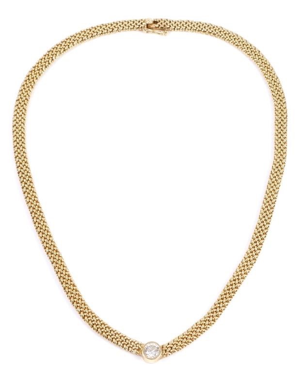 Appraisal: k yellow gold necklace contains one round brilliant cut diamond