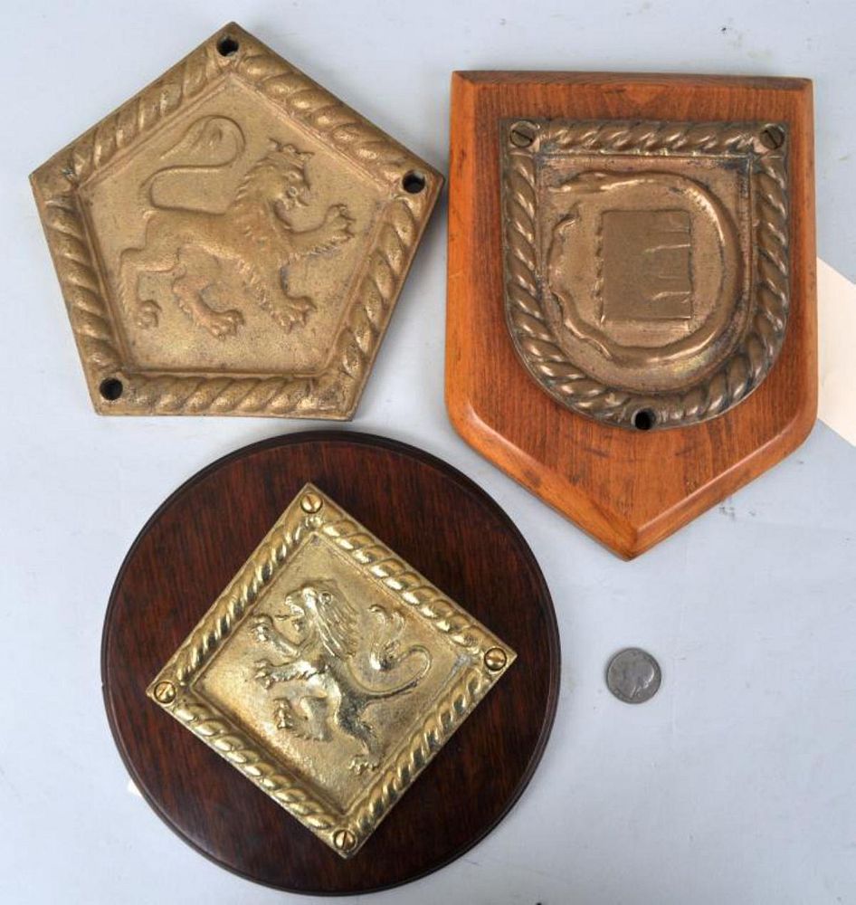 Appraisal: Group Three Bronze Ship's Badges for vessels HMS Shoreham Devonshire