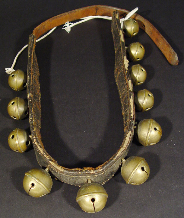 Appraisal: Set of old brass cow bells on a leather collar