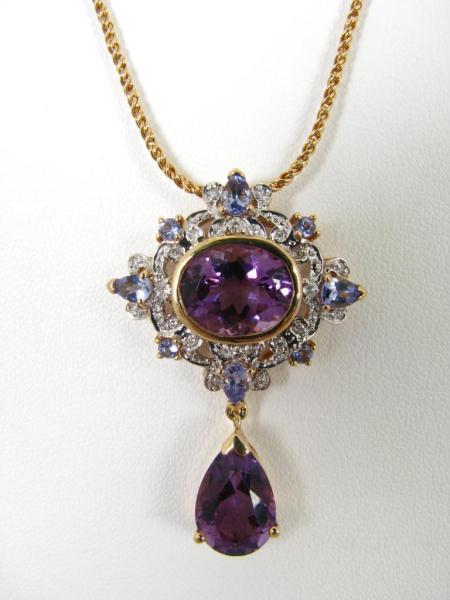 Appraisal: A K Yellow Gold Pendant with Amethysts Sapphires Diamonds