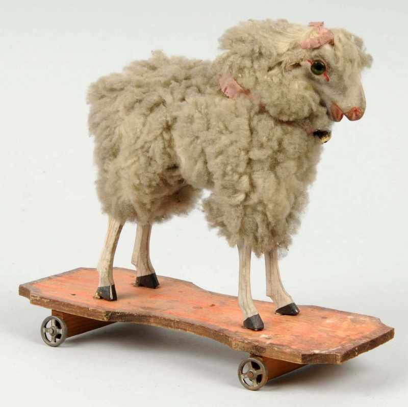 Appraisal: Large Putz Sheep Pull Toy Description All original Wooden base