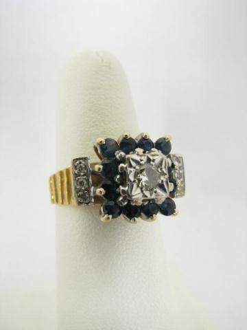 Appraisal: k yellow gold bark finish lady's ring with sapphires and