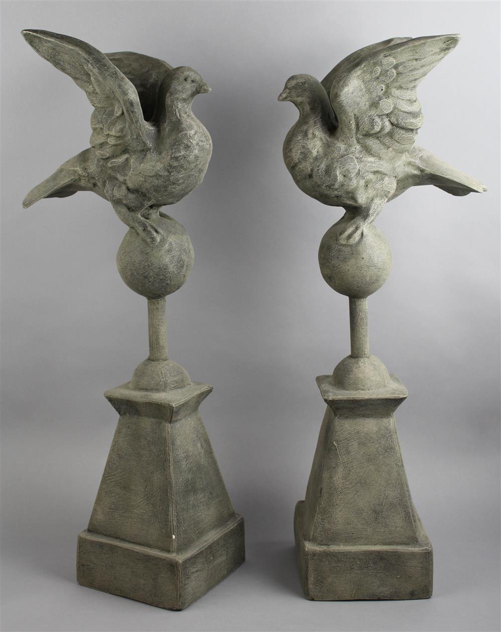 Appraisal: PAIR OF COMPOSITE GARDEN ORNAMENTS WITH FIGURE OF A DOVE