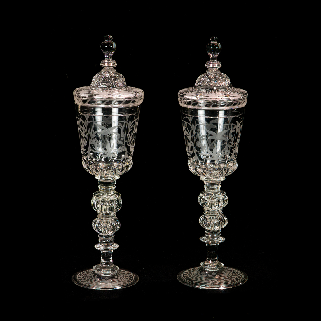 Appraisal: A PAIR OF LOBMEYER ENGRAVED GLASS COVERED POKALS A pair