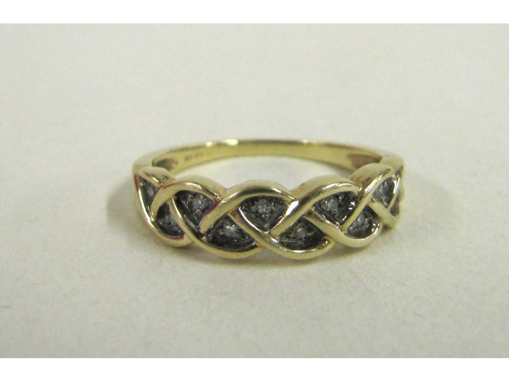 Appraisal: Nine carat gold diamond set knotwork half hoop ring