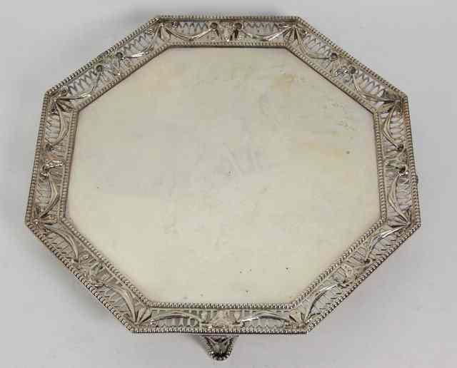 Appraisal: An octagonal silver salver William Comyns London with pierced border