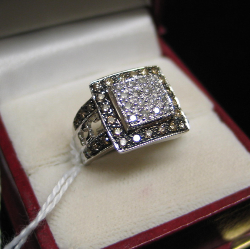 Appraisal: DIAMOND AND FOURTEEN KARAT WHITE GOLD RING set with round-cut