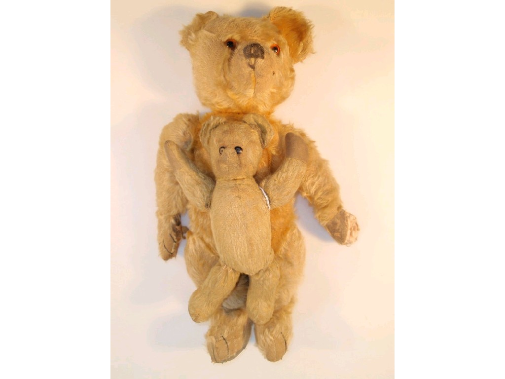 Appraisal: A mid thC teddy bear gold mohair kapok stuffed long