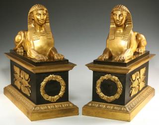 Appraisal: A PAIR GILT AND PATINATED BRONZE CHENETS WITH SPHINX A