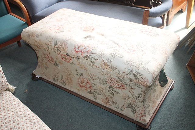 Appraisal: A VICTORIAN UPHOLSTERED OTTOMAN STOOL on flattened supports with original