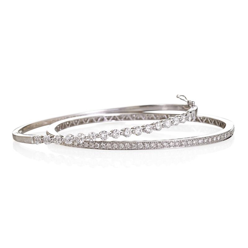 Appraisal: TWO DIAMOND K WHITE GOLD HINGED BANGLE BRACELETS RBC diamonds