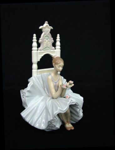 Appraisal: Lladro In Admiration figurine depicting ballerina seated with roses introduction