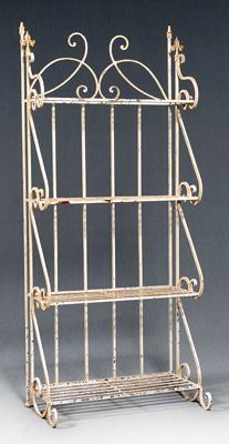 Appraisal: Painted iron four-tier baker s rack scrolled back and fleur-de-lis