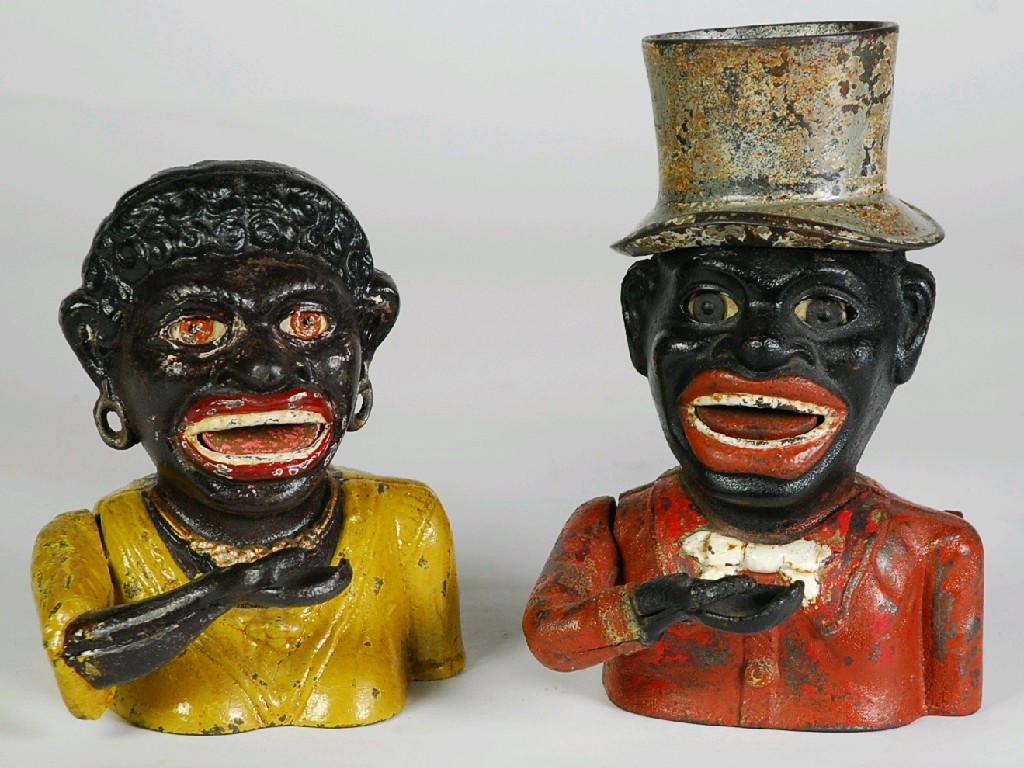 Appraisal: PAIR OF 'JOLLY' CAST IRON MONEY BOXES one modelled as