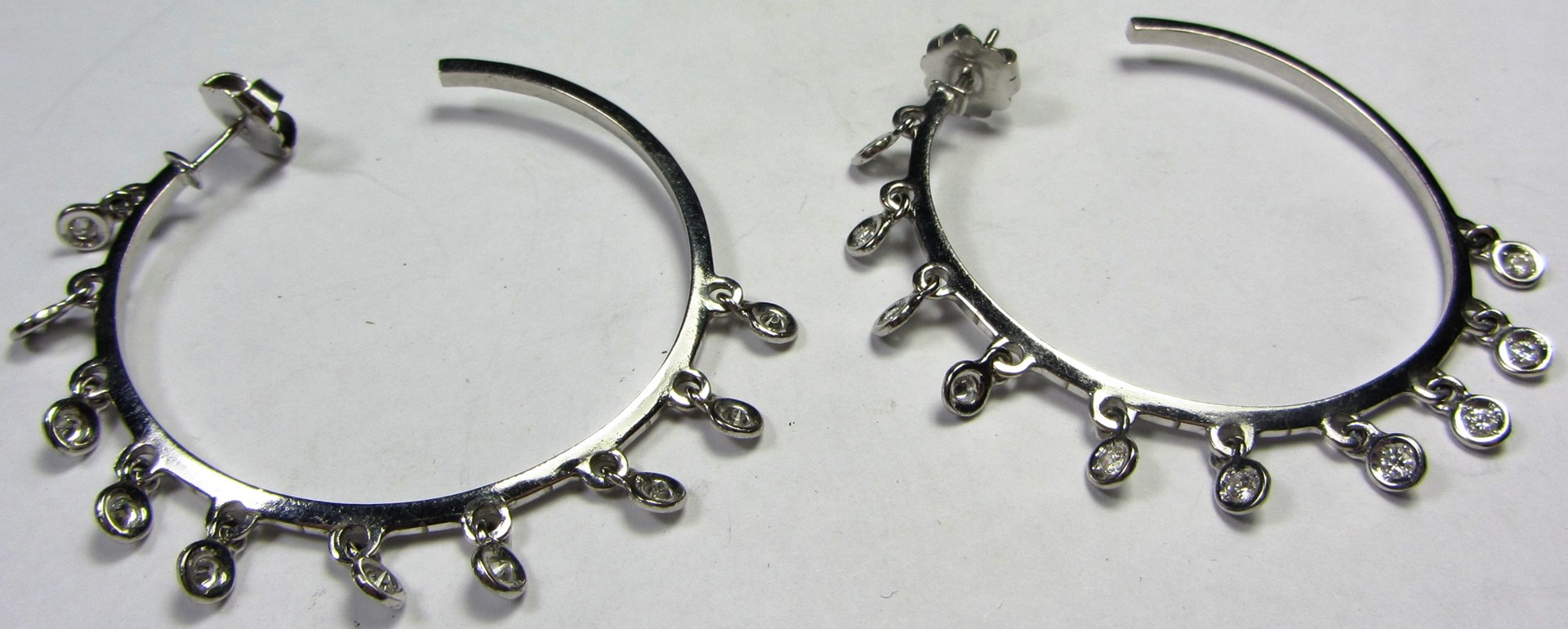 Appraisal: A pair of white gold and diamond set earrings each