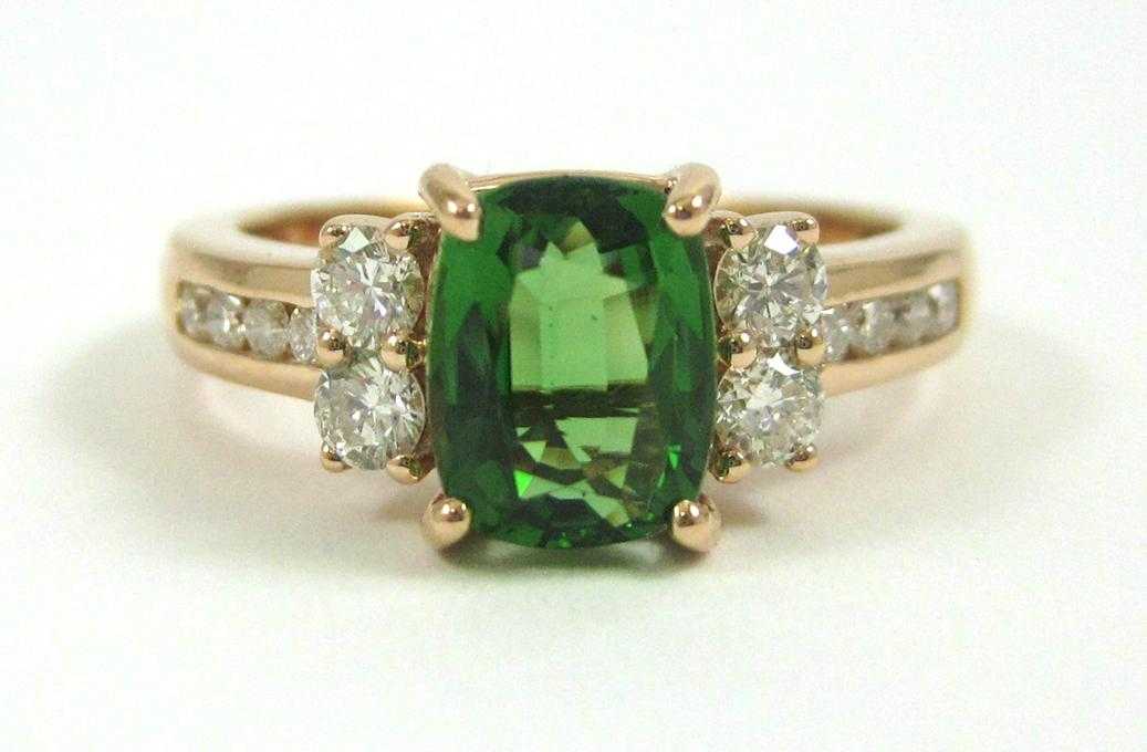 Appraisal: GREEN TOURMALINE AND DIAMOND RING The k rose gold ring