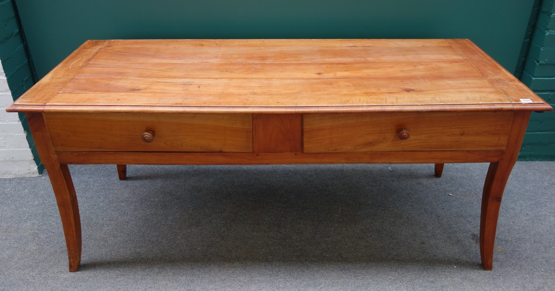 Appraisal: A th century French cherry wood rectangular farmhouse table with