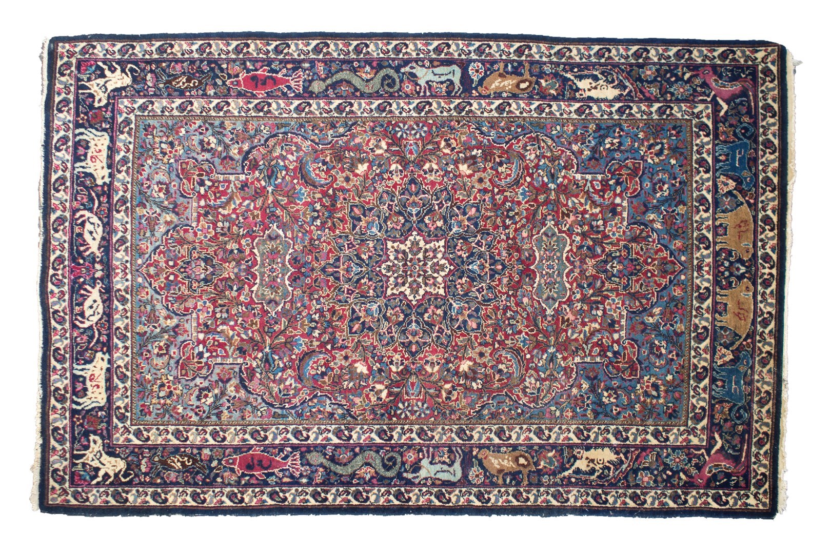 Appraisal: A Mashad rug Persian the dark madder field with a