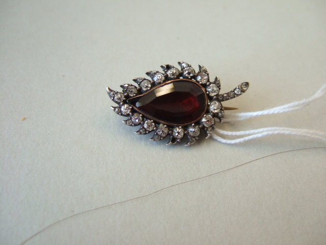 Appraisal: A garnet and diamond brooch probably mid th century mounted