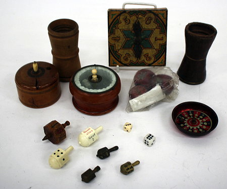 Appraisal: AN OLD TURNED BOXWOOD DICE SHAKER together with a leather