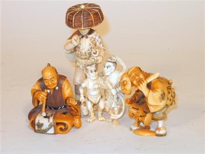 Appraisal: Four Japanese elephant ivory okimono Comprised of a standing swordsman