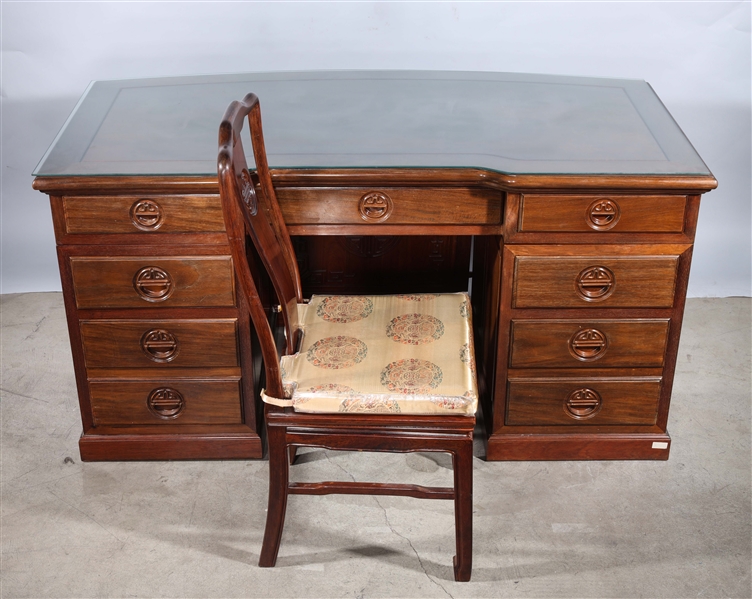 Appraisal: Large wooden desk with matching chair and geometric carvings desk