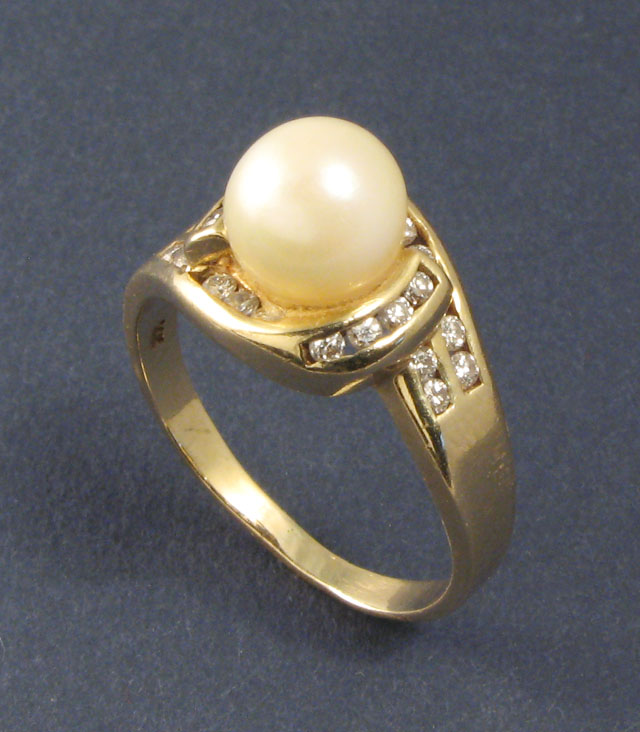 Appraisal: PEARL DIAMOND AND FOURTEEN KARAT GOLD RING centering a mm