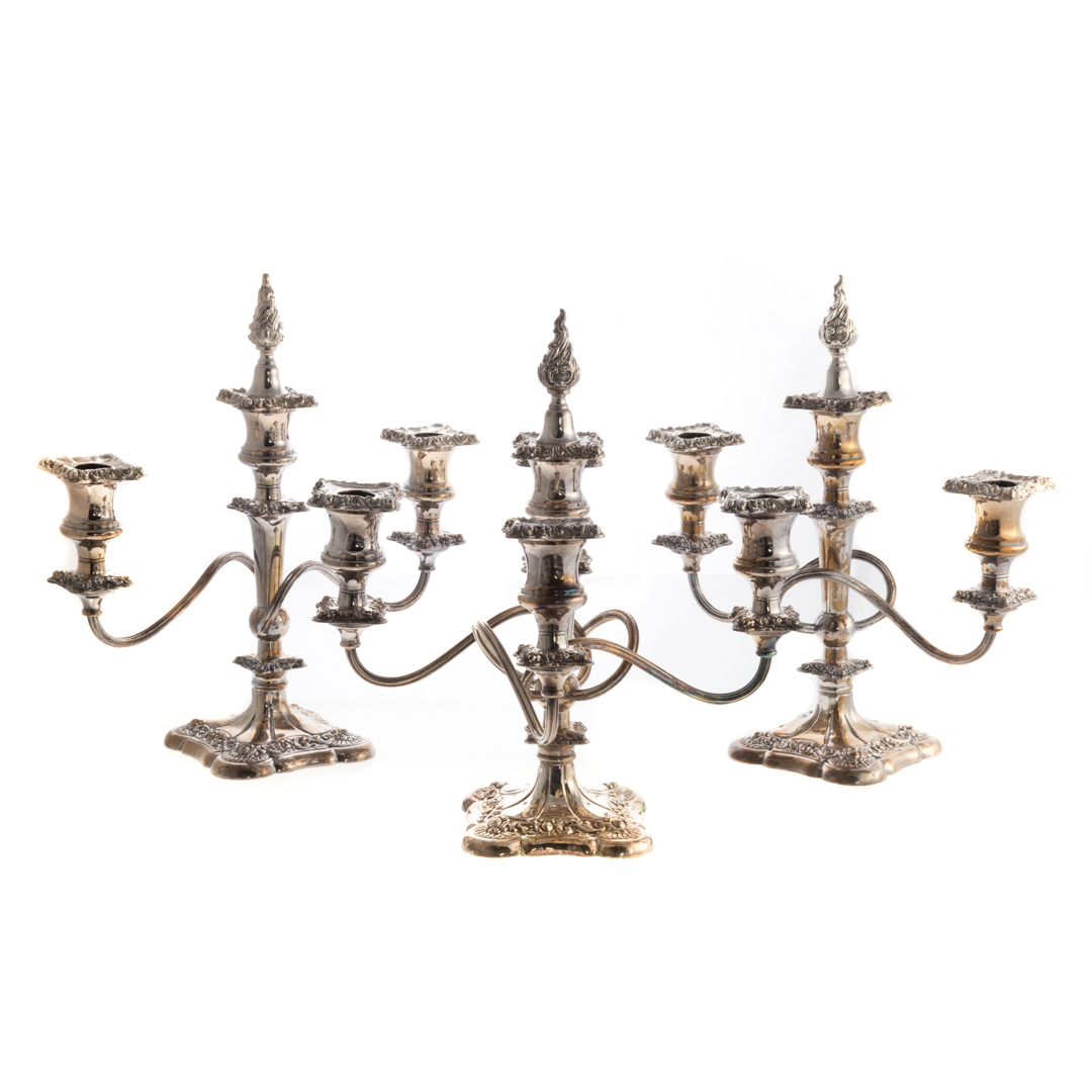 Appraisal: Three Rococo silver plated candelabrum International silver plate on copper