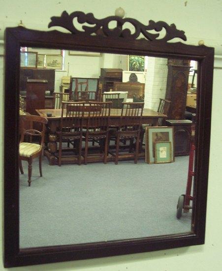 Appraisal: A rosewood framed mirror with fret carved crest the glass