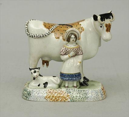 Appraisal: English Pottery Figure of a Milkmaid and Cow