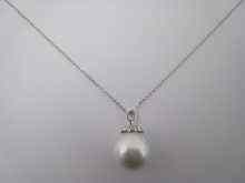 Appraisal: A South Sea cultured pearl pendant with white metal tests