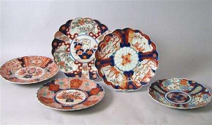 Appraisal: Five scalloped-edge chargers All painted with floral and geometric decoration