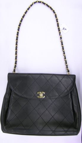 Appraisal: Chanel handbag quilted black leather with toggle clasp with flap