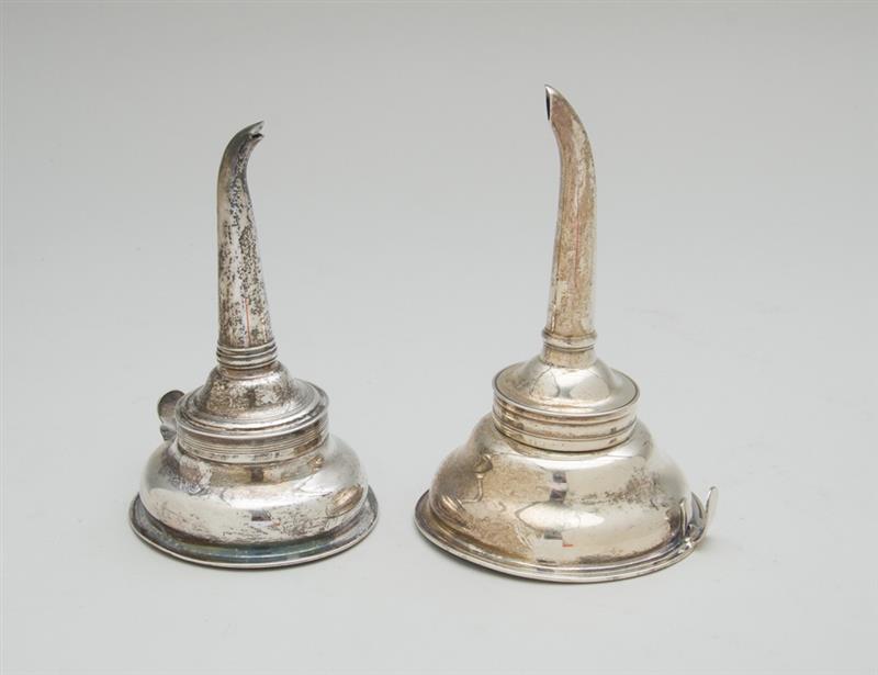 Appraisal: TWO SIMILAR GEORGE III SILVER TWO-PIECE WINE FUNNELS The larger