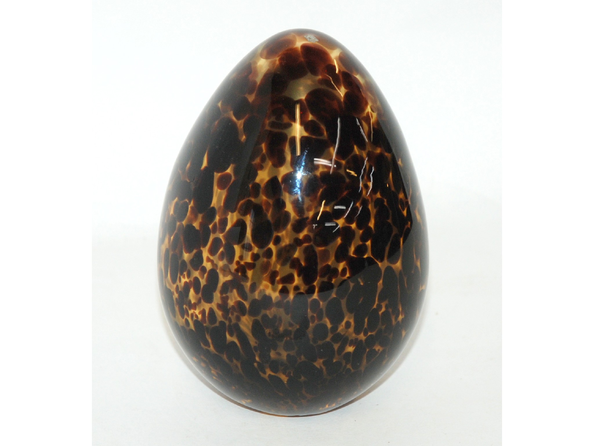 Appraisal: A Murano glass 'tortoiseshell effect' egg paperweight