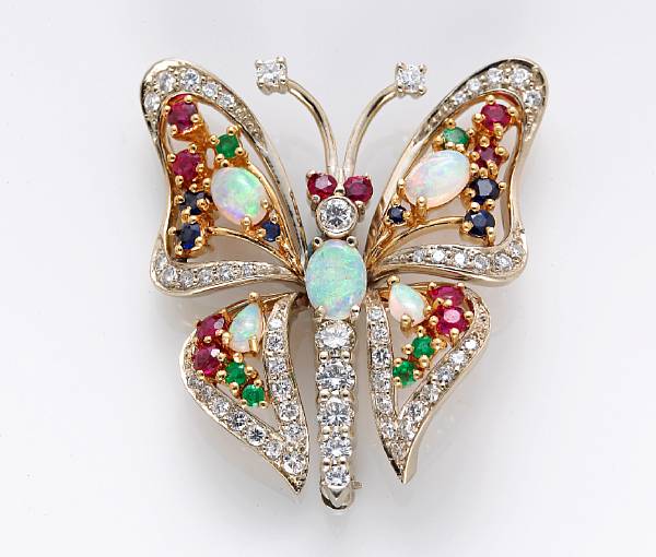 Appraisal: A gem-set and diamond articulated butterfly brooch comprising opal ruby