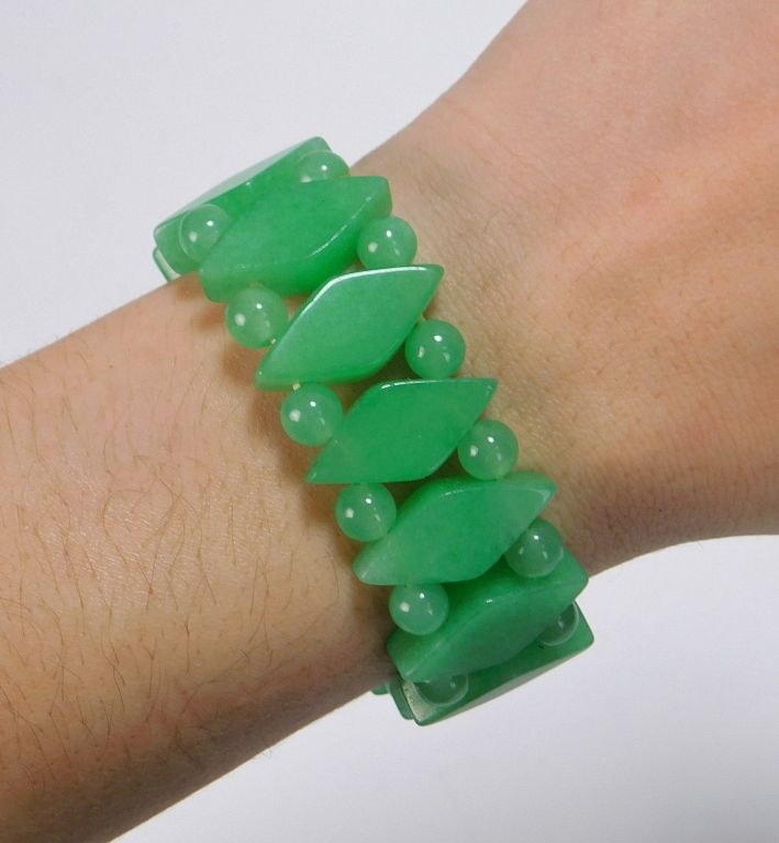 Appraisal: Chinese Carved Jadeite Bracelet China th Century Double strand of