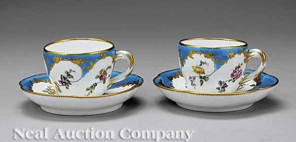 Appraisal: A Pair of French Floral and Gilt Decorated Cups and