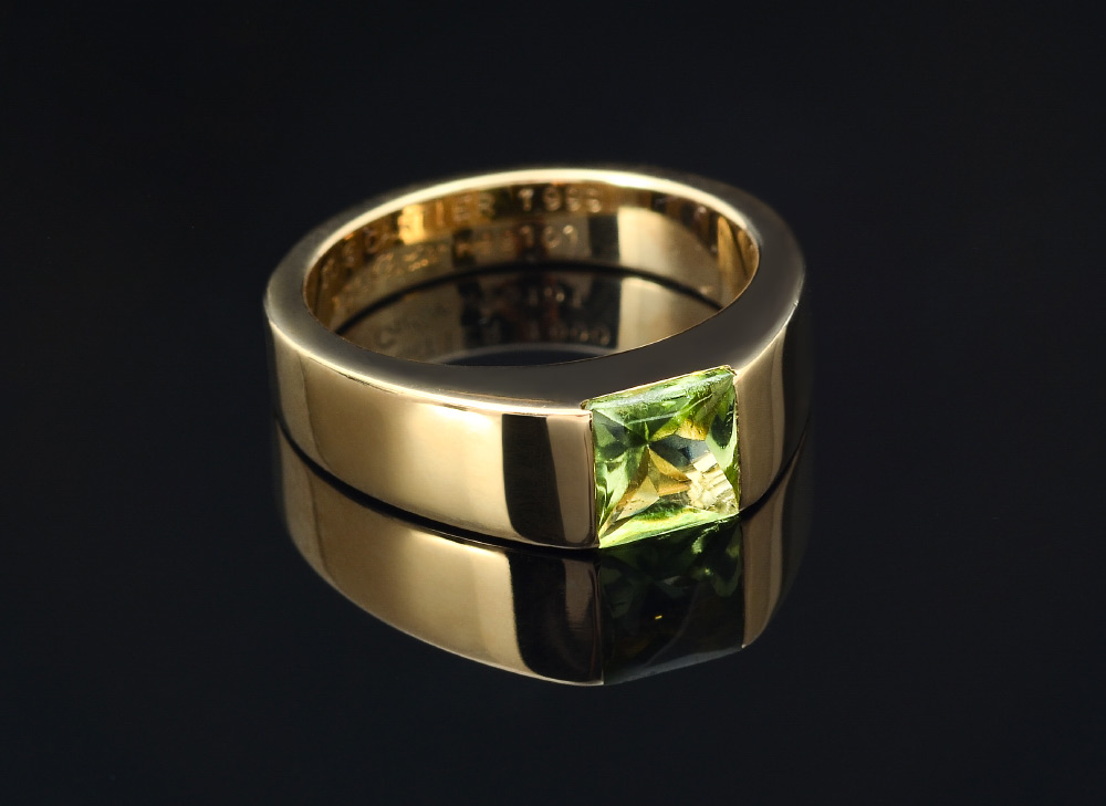 Appraisal: K CARTIER PERIDOT TANK RING K yellow gold ''Tank'' ring